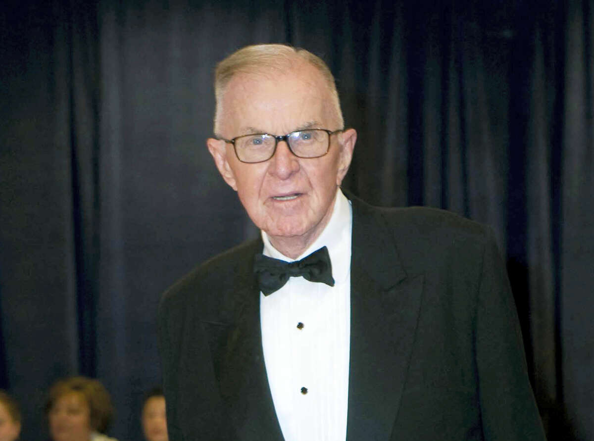 John McLaughlin arrives at the White House Correspondents’ Association Dinner in Washington in 2012. McLaughlin, the conservative political commentator and host of the namesake long-running television show that pioneered hollering-heads discussions of Washington politics, died Tuesday, Aug. 16, 2016, according to the Facebook page for “The McLaughlin Group.” He was 89.