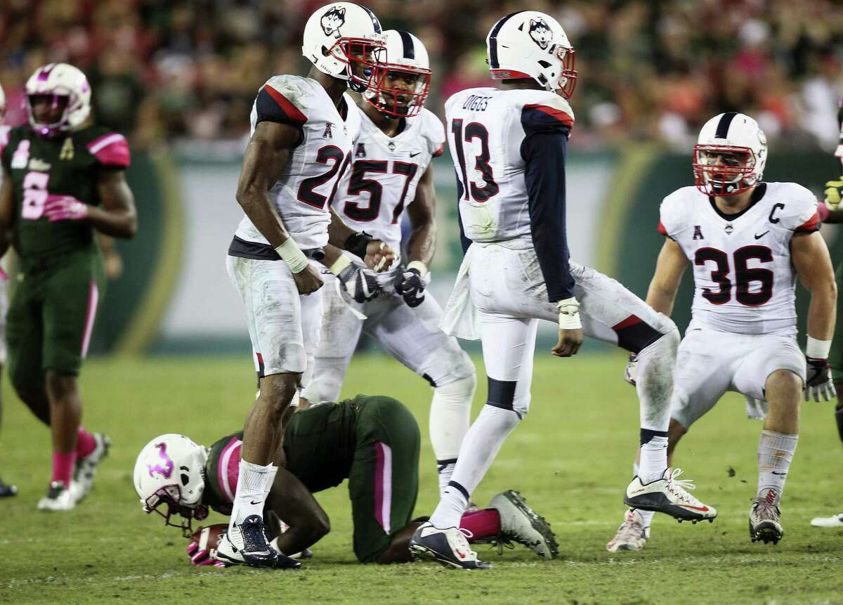 UConn linebacker Vontae Diggs (13) celebrates making a defensive stop against South Florida on Saturday.