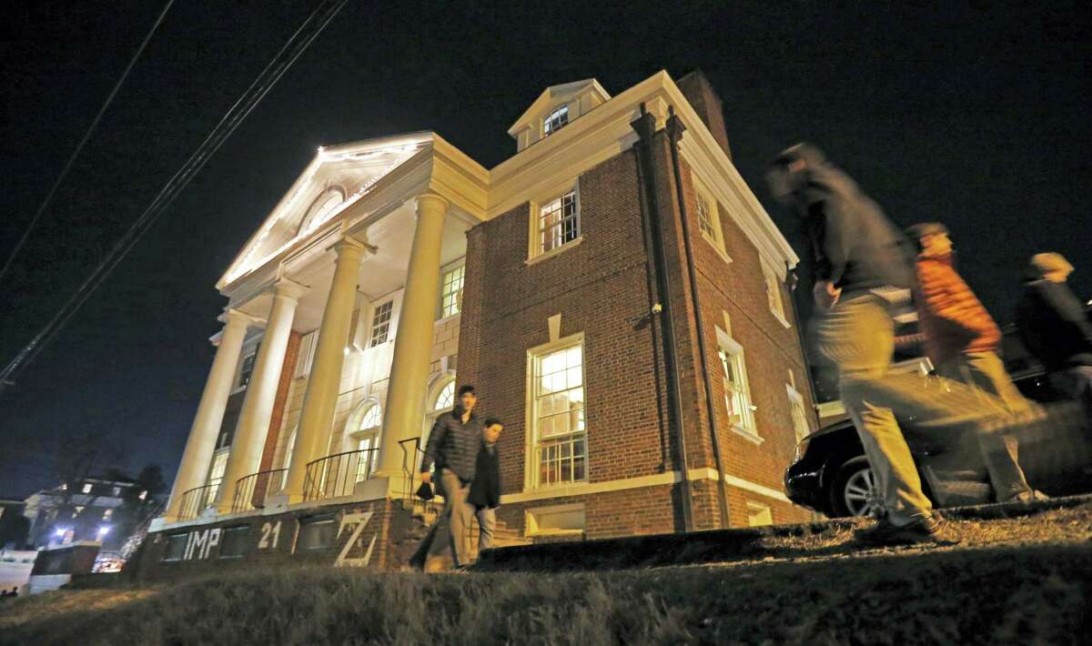 In this Jan. 15, 2015 photo shows students participate in rush pass by the Phi Kappa Psi house at the University of Virginia in Charlottesville, Va. The house was depicted in a debunked Rolling Stone story as the site of a rape in September of 2012. A defamation trial against the magazine is set to begin on Monday, Oct. 17, 2016 over its article about “Jackie” and her harrowing account of being gang raped in a fraternity initiation.