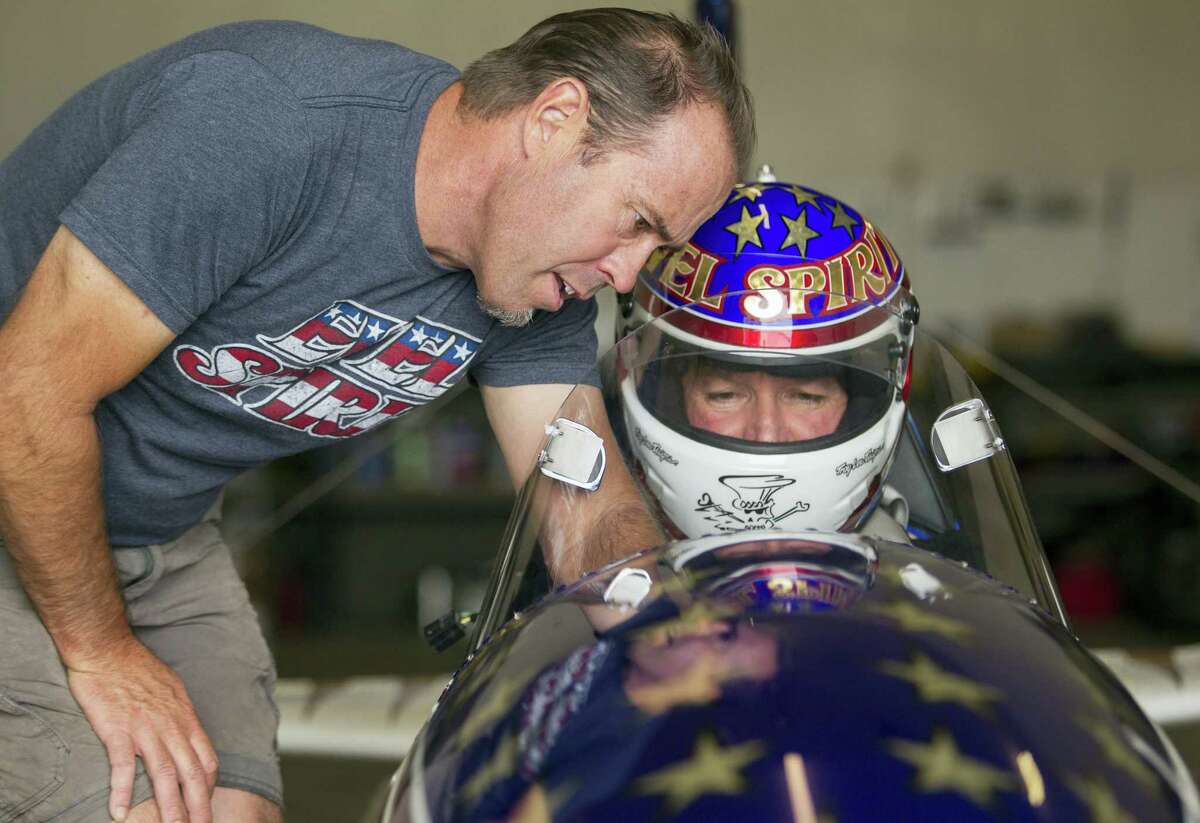 Rocket designer Scott Truax, left, talks with professional stuntman Eddie Braun at the team’s shop in Twin Falls, Idaho. Braun is preparing to attempt to jump the Snake River Canyon in a steam-powered replica of Evel Knievel’s rocket.