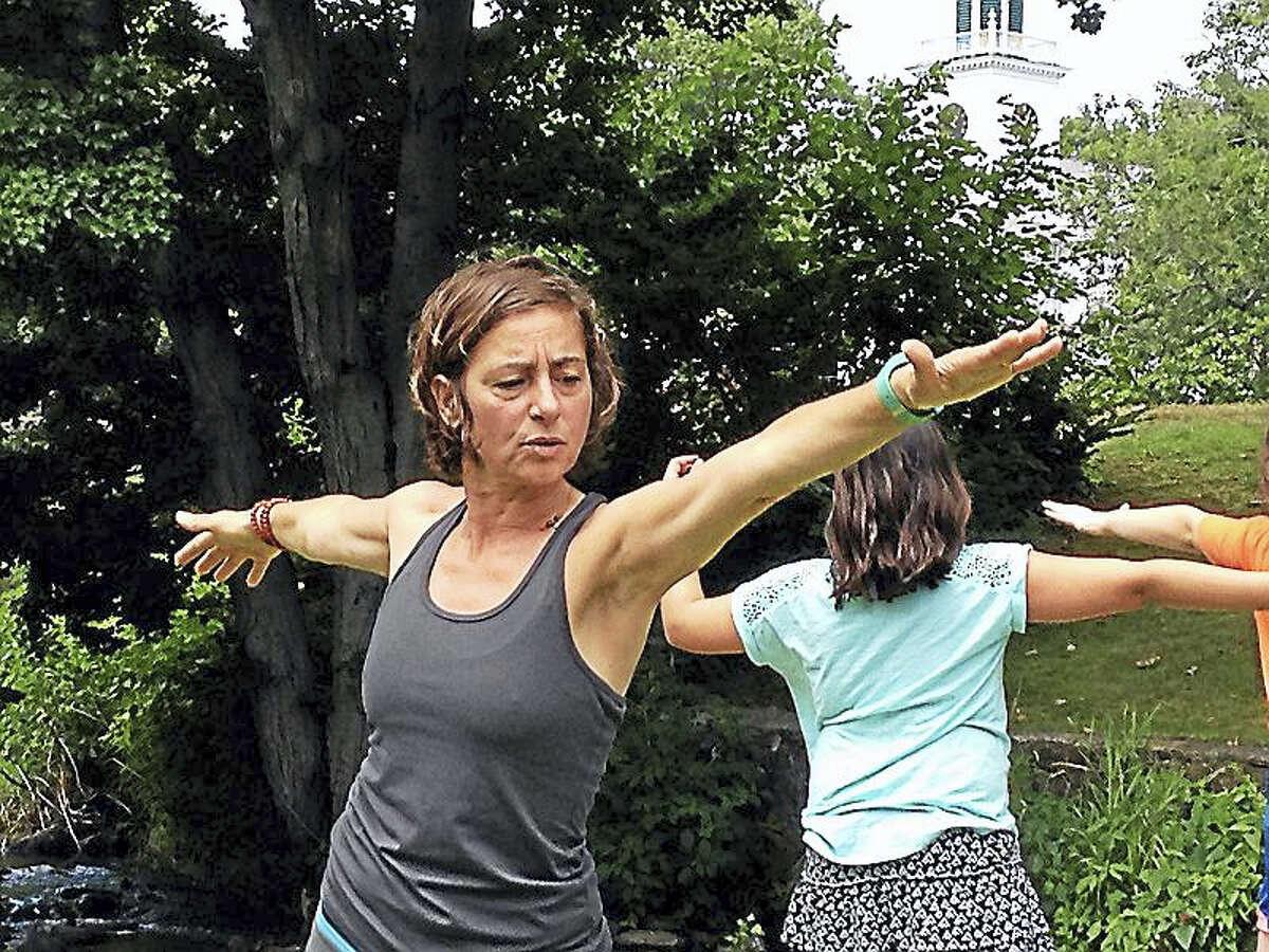 Traci Weber, founder and owner of WalkAbout Yoga, gave a free class and demonstration by the duck pond during a recent session of “River Street Wednesdays,” a collaboration between the city and Milford Arts Council which provide entertainment in order to draw more people downtown, especially the section not on the main city Green.