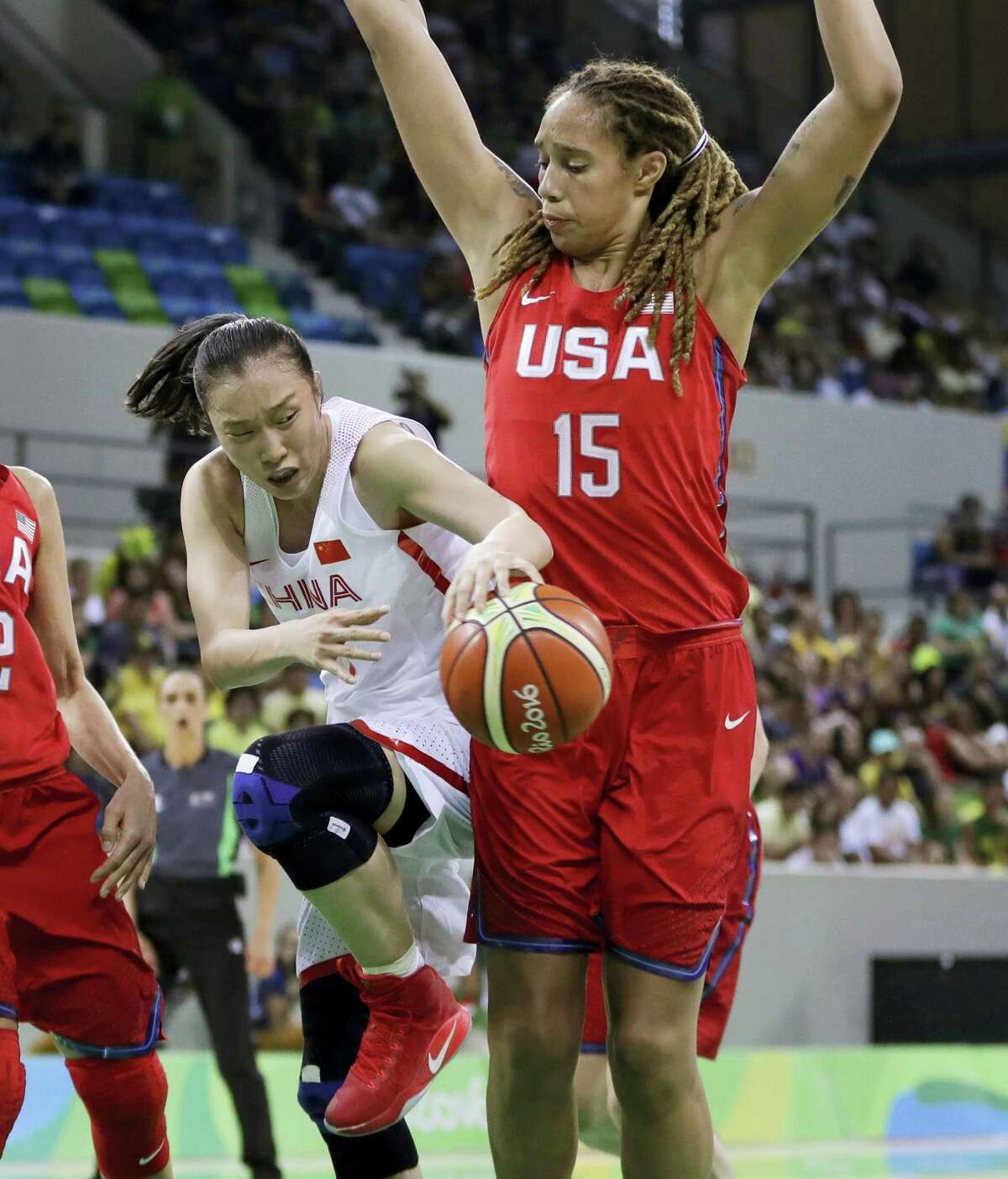 China forward Ting Shao passes the ball around United States center Brittney Griner during the second half.
