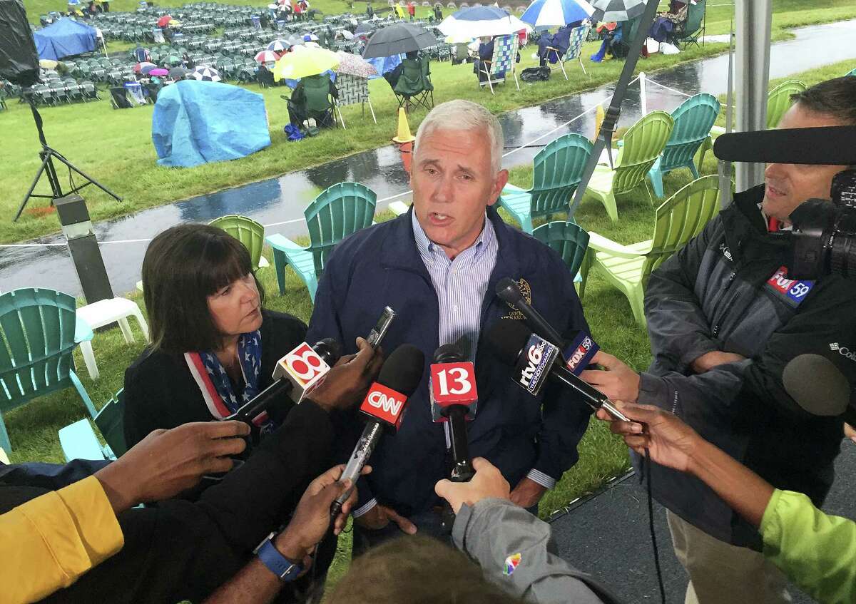 In this July 3 file photo, Indiana Gov. Mike Pence speaks during a news conference before attending Symphony on the Prairie for a Fourth of July concert in Fishers, Indiana. Pence is one of several Republicans Trump is considering for his vice presidential running mate. Trump is expected to announce his decision on Friday.