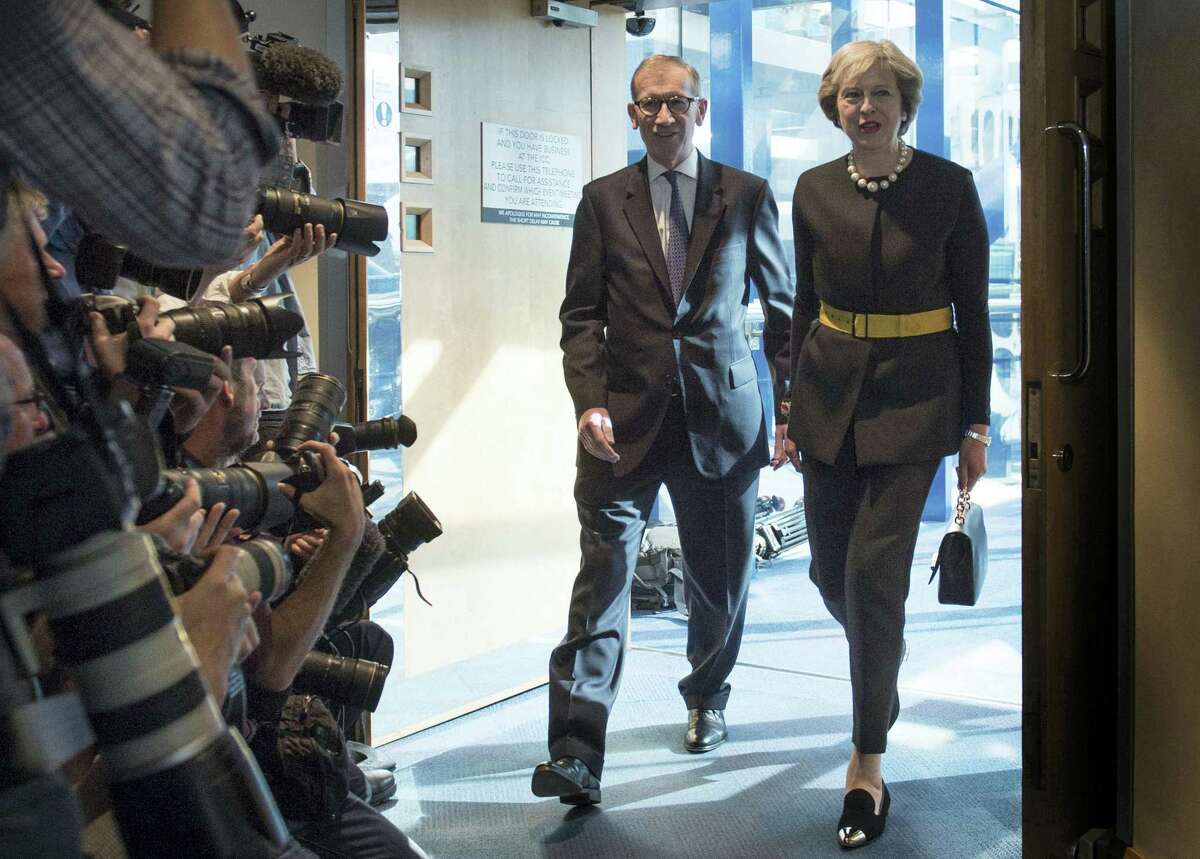 Britain’s Prime Minister Theresa May and her husband Philip are watched by the media as they arrive at the Conservative Party Conference in Birmingham, England, Oct. 2.