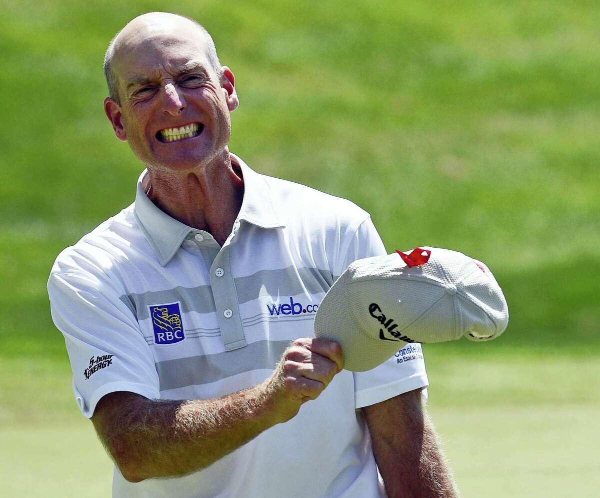 Jim Furyk celebrates after shooting a PGA-record 58 at the Travelers last Sunday.
