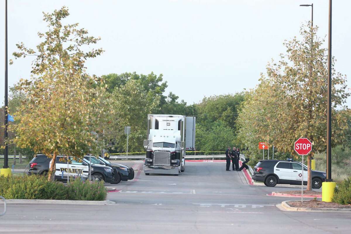 Law enforcement is at the scene where people were discovered inside a tractor trailer in a Walmart parking lot at IH35 South and Palo Alto Road, Sunday, July 23, 2017. Reports say that 8 were dead be several were in critical condition.