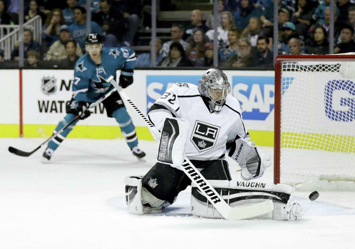 Kings goalie Jonathan Quick deflects a shot against the Sharks on Wednesday.
