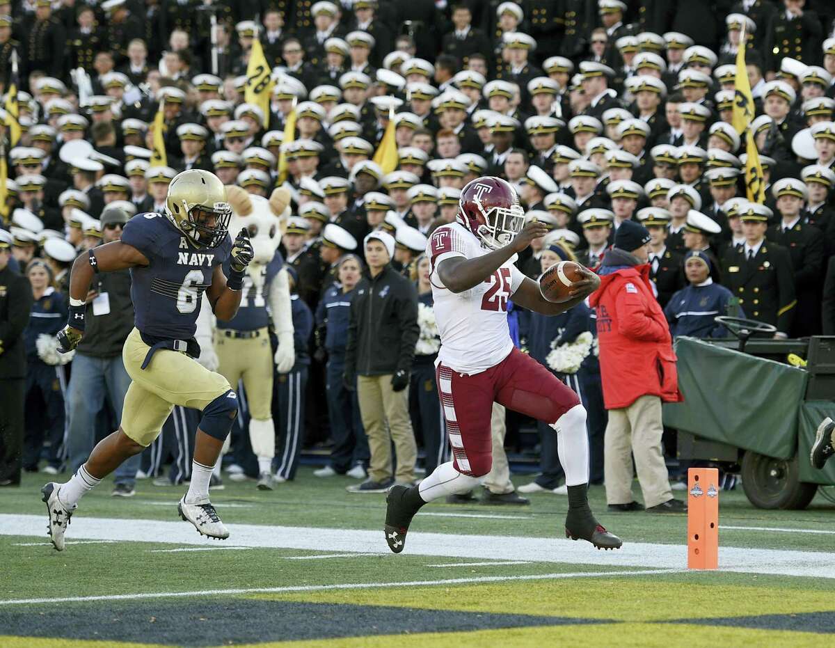 Temple running back Ryquell Armstead runs for a touchdown past Navy safety Sean Williams during the second half Saturday in Annapolis, Md.