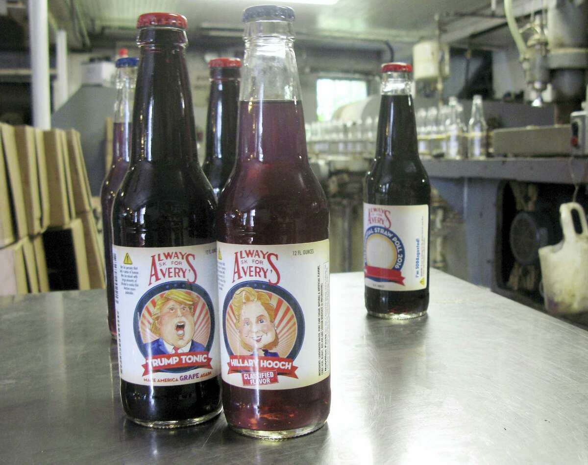 Samples of Avery’s Beverages’ latest specialty sodas, Trump Tonic, left, and Hillary Hooch, stand on a table at the company’s bottling facility Monday in New Britain. This is the third presidential race for which the company created candidate-based sodas and held a straw poll based on sales. During the last two cycles, Barack O’Berry beat John McCream and Cream de Mitt.