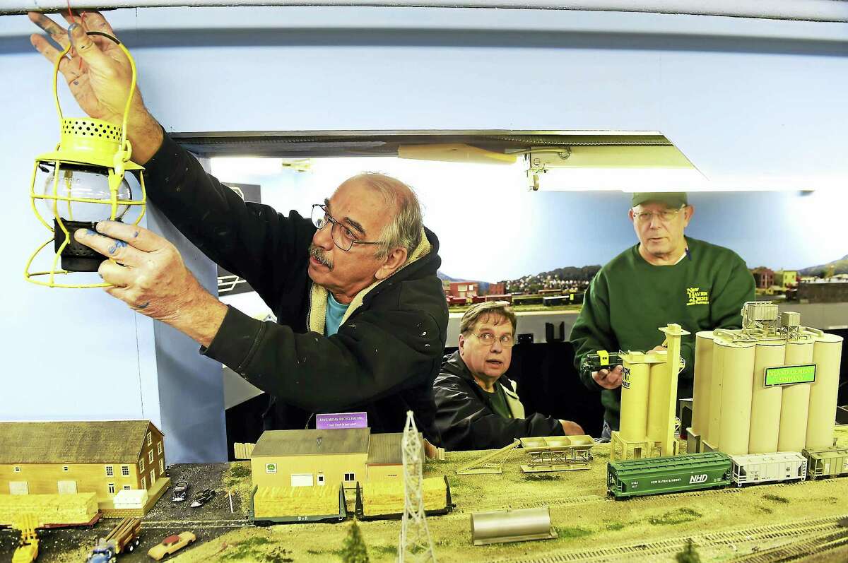 Bob Savarese, Ken Lord and Howard Williams, left to right, of the New Haven and Derby Model Railroad Club in with the club’s model railroad display in the basement of the Academy Building of the Orange Historical Society Friday, Dec. 2, 2016. The club will open its free model railroad exhibit after the Orange Christmas Tree lighting ceremony Sunday, Dec. 4 at the Orange Historical Society.