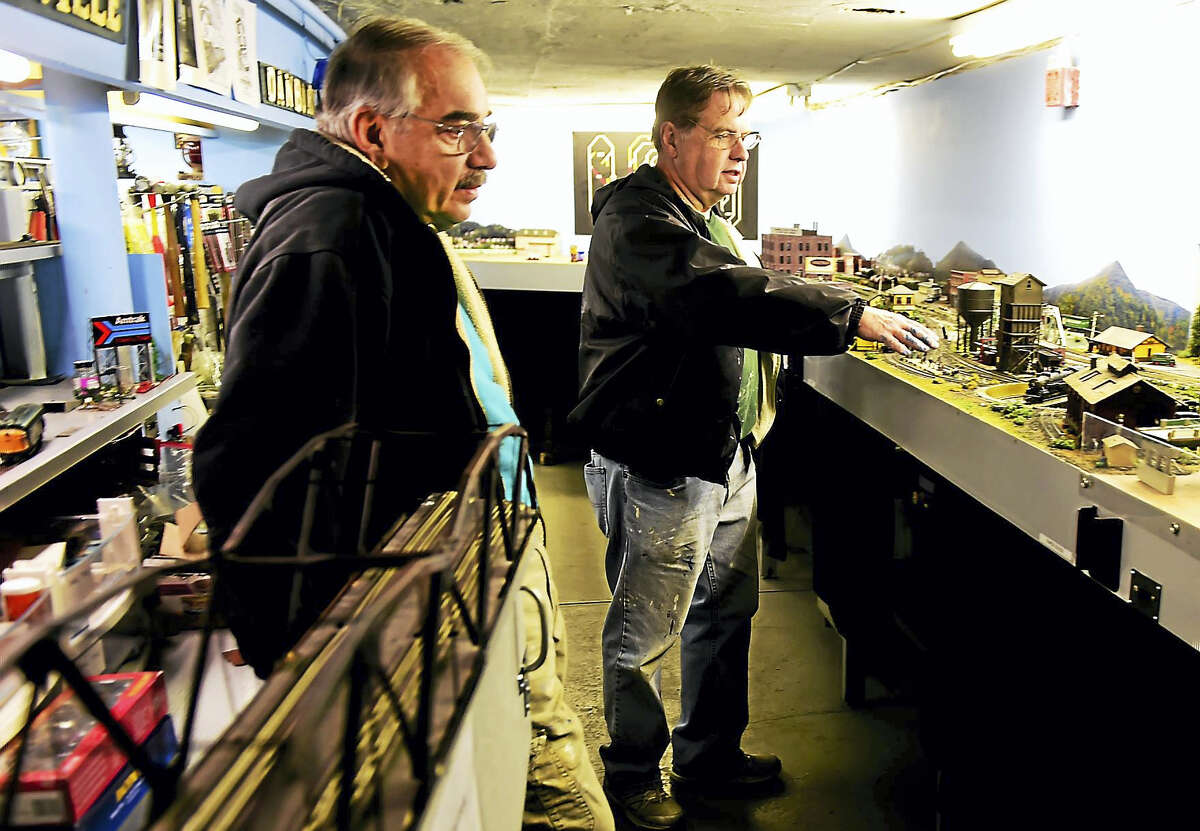 Bob Savarese, left, and Ken Lord of the New Haven and Derby Model Railroad Club in with the club’s model railroad display in the basement of the Academy Building of the Orange Historical Society Friday, December 2, 2016. The club will open its free model railroad exhibit after the Orange Christmas Tree lighting ceremony Sunday December 4 at the Orange Historical Society.