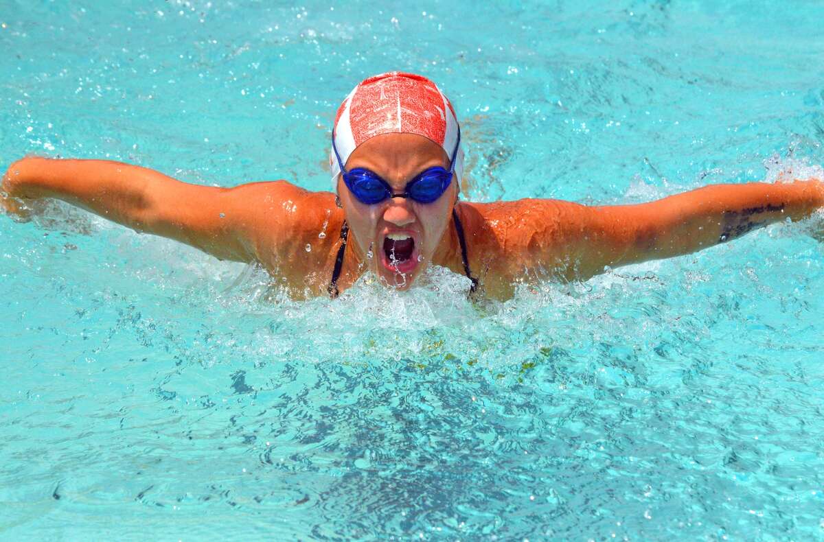 Izzy O’Day of Sunset Hills competes in the girls’ 11-12 100-meter individual medley during Sunday’s SWISA Championships at Paddlers Swim Club in Granite City.