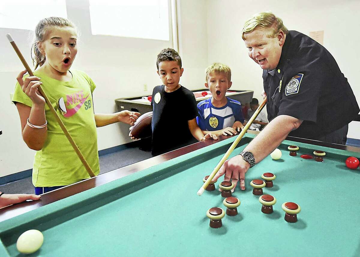 Kids from the Boys and Girls Club in Seymour throw cops a party to say
