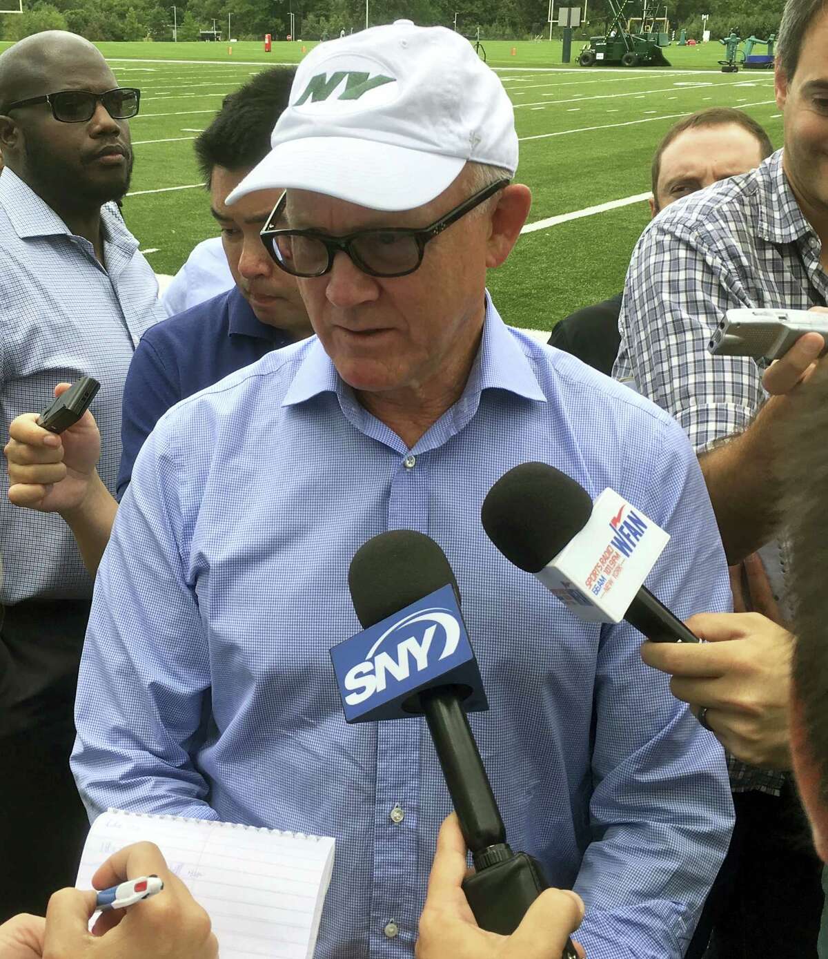 New York Jets owner Woody Johnson speaks to members of the media.