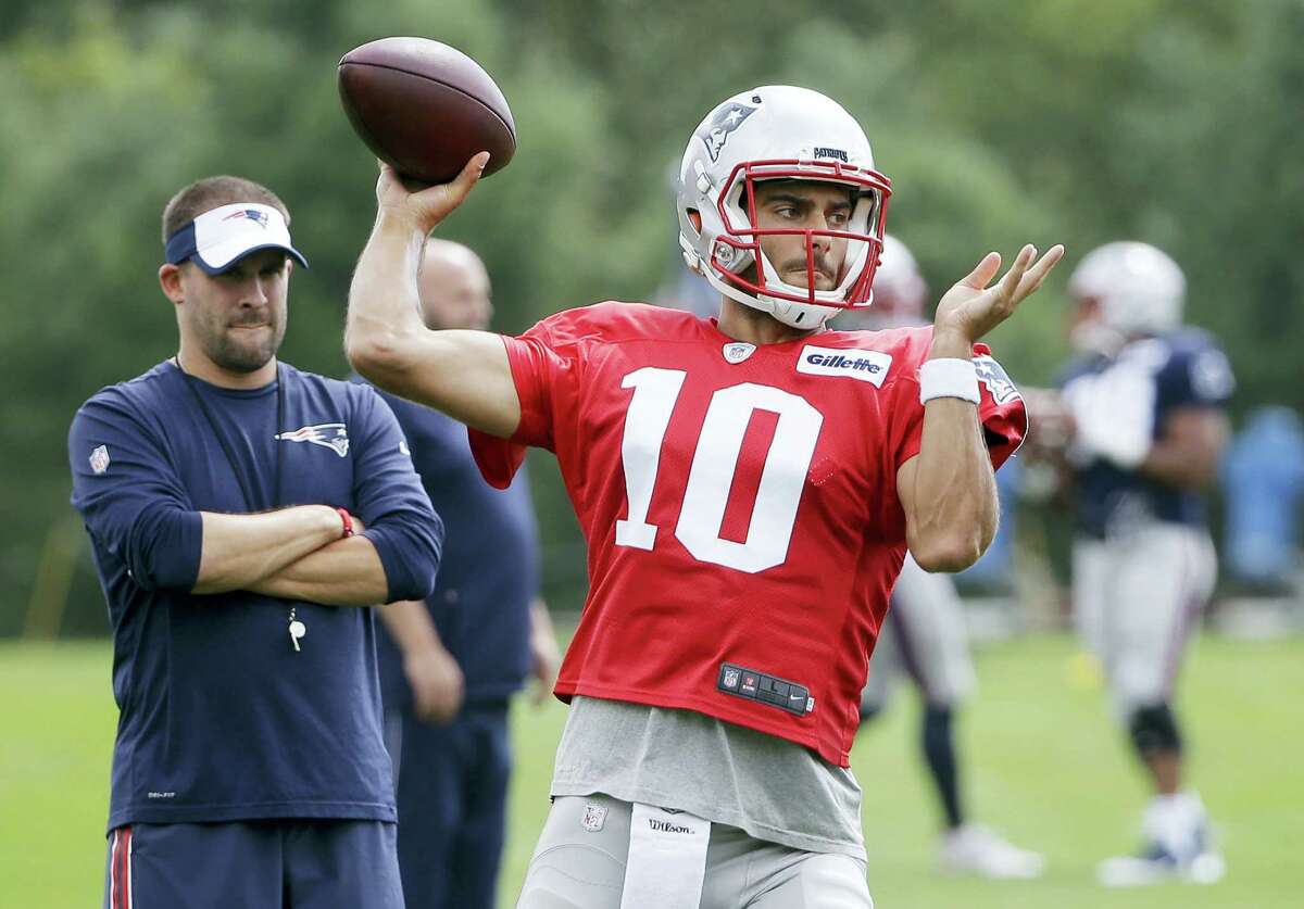 Patriots quarterback Jimmy Garoppolo winds up for a pass during a recent practice.