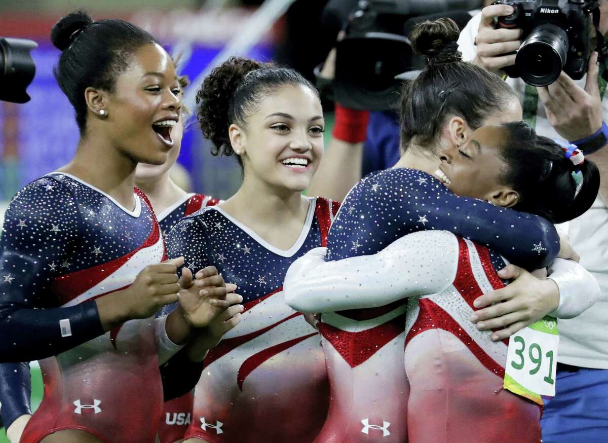From left, Gabrielle Douglas, Lauren Hernandez, Aly Raisman and Simone Biles celebrate at the end of Tuesday’s competition.