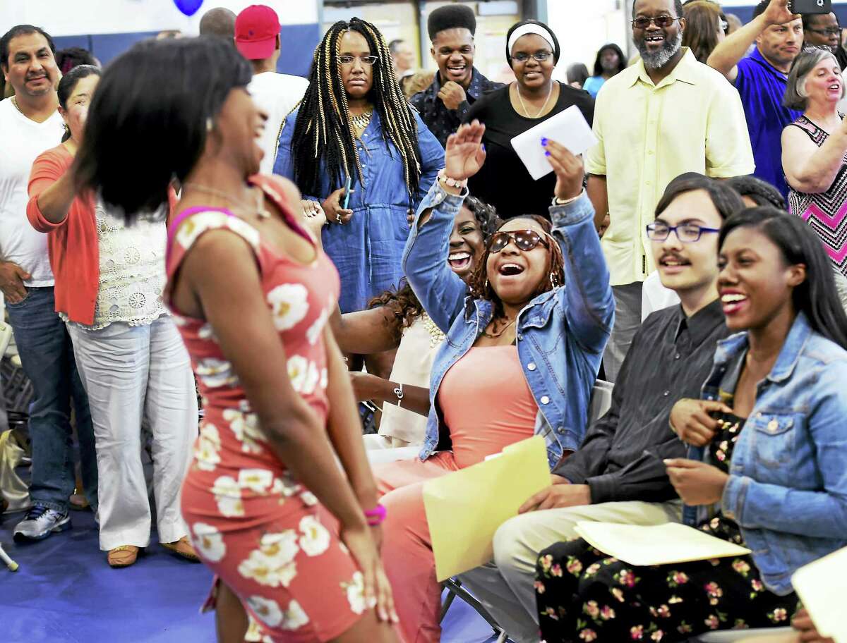 Mercedes Alexander of New Haven, an Achievement First Amistad High School senior, celebrates fellow students during a ceremony May 26 when students announced their college choices.
