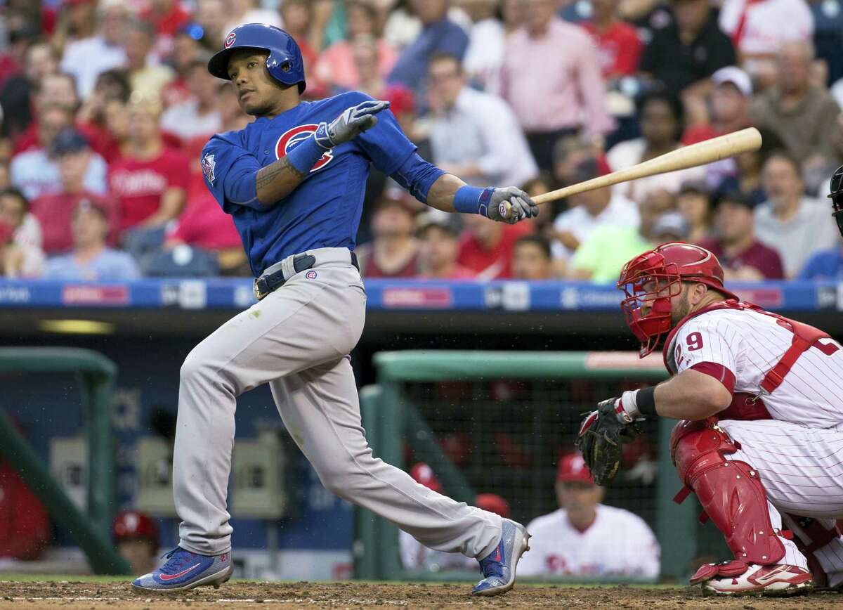 In this June 6, 2016, file photo, Chicago Cubs’ Addison Russell bats against the Philadelphia Phillies. The Chicago Cubs became the first team since the 1976 Cincinnati Reds’ Big Red Machine to have five players voted as All-Star Game starters when their entire infield earned the honor Tuesday along with center fielder Dexter Fowler. First baseman Anthony Rizzo, second baseman Ben Zobrist, shortstop Russell and third baseman Kris Bryant also were elected. The only other team to start four infielders was the 1963 St. Louis Cardinals.