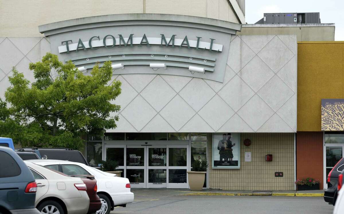 Cars are parked near an entrance to the Tacoma Mall, Wednesday, Sept. 7, 2016, in Tacoma, Wash. A Washington state teenager who was riding her bicycle through the mall parking lot when an off-duty officer working as a security guard threw her to the ground and shocked her with a stun gun is suing the Tacoma Police Department.