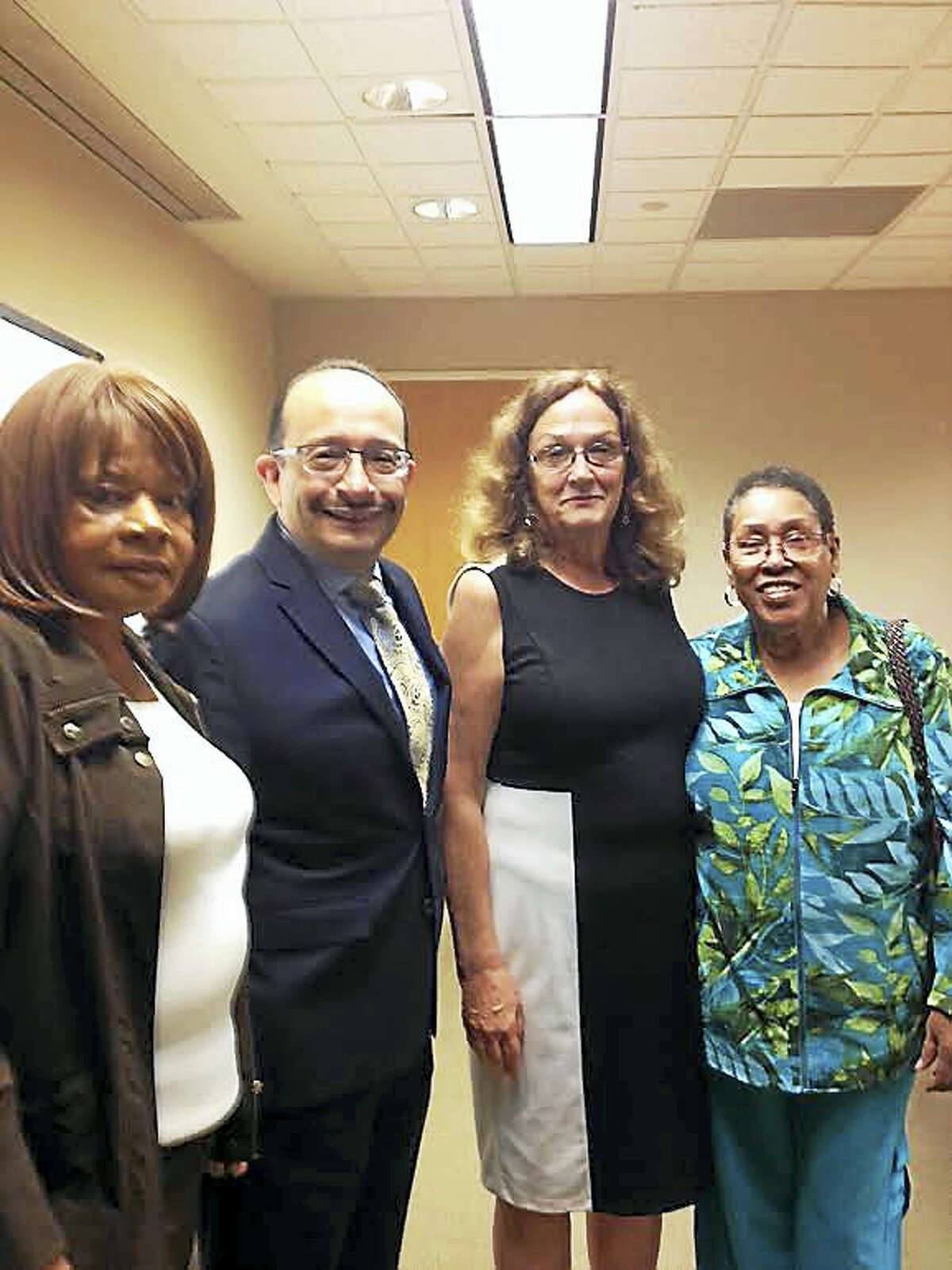 The Commission on Equal Opportunities has hired Angel Fernandez-Chavero, second from left, as its acting executive director. From left is commissioner Edith Rawls, former interim executive director Lila Snyder and commissioner Gwen Newton.