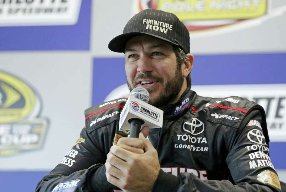 Martin Truex Jr. answers a question during a news conference at Charlotte Motor Speedway in Charlotte, N.C., on Thursday.