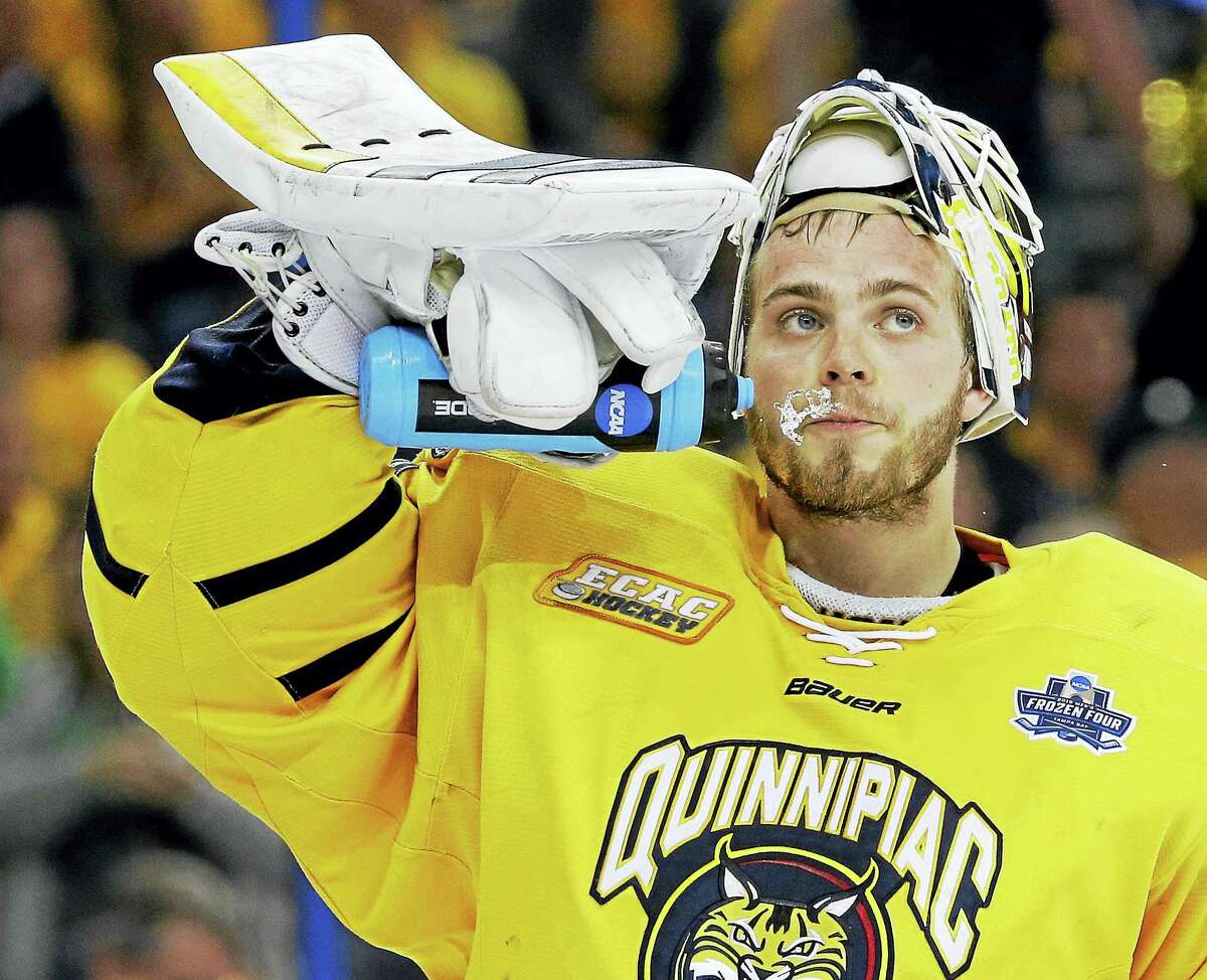 Quinnipiac goalie Michael Garteig spits water after giving up a goal to North Dakota in NCAA Frozen Four championship game in Tampa, Fla., in April.