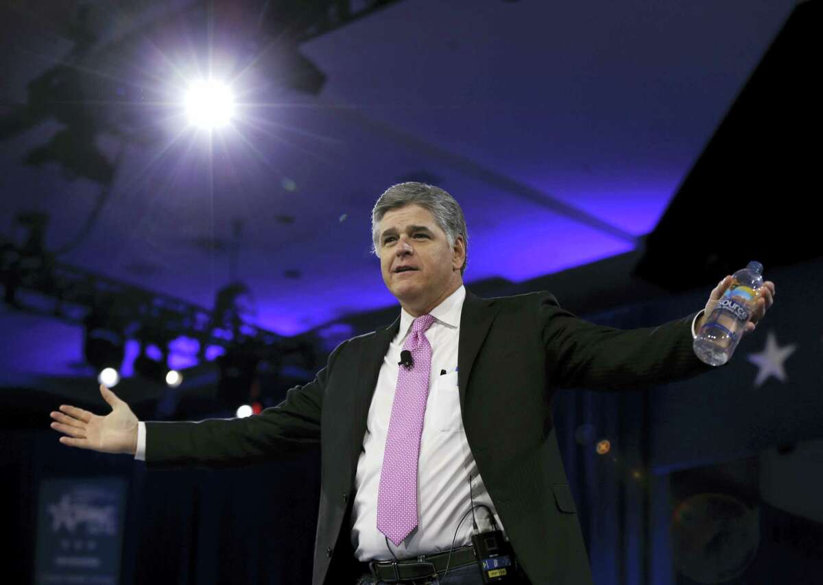 In this photo taken March 4, 2016, Sean Hannity of Fox News arrives in National Harbor, Md.