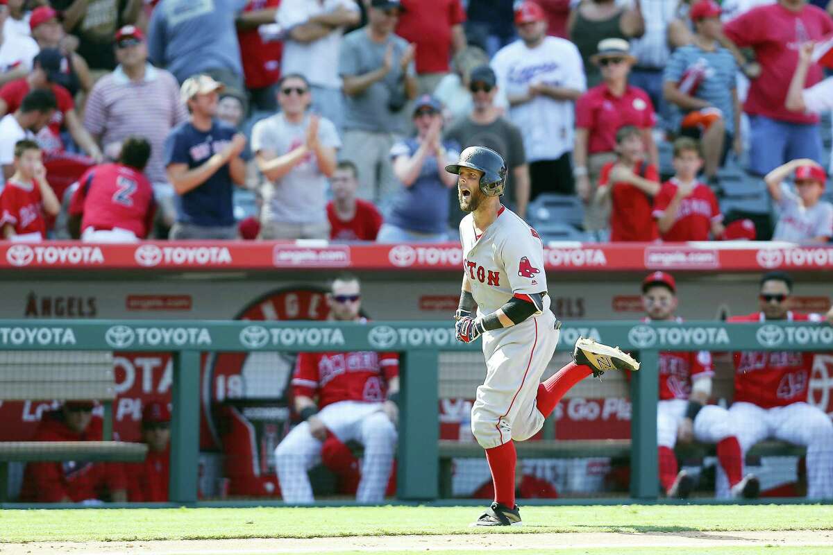 Boston Red Sox second baseman Dustin Pedroia heads to home plate after hitting a three-run home run to put them over the Los Angeles Angels during the ninth inning of a baseball game, Sunday, July 31, 2016, in Anaheim, Calif. (AP Photo/Ryan Kang)