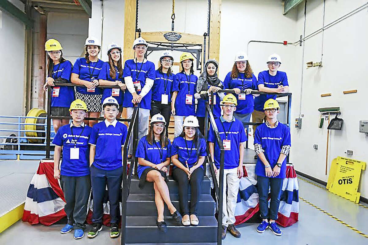 Wallingford high school students and students from China tour the Otis elevator company last year, when the studetns from China came to the U.S. for the Junior Achievement Global Connection program.