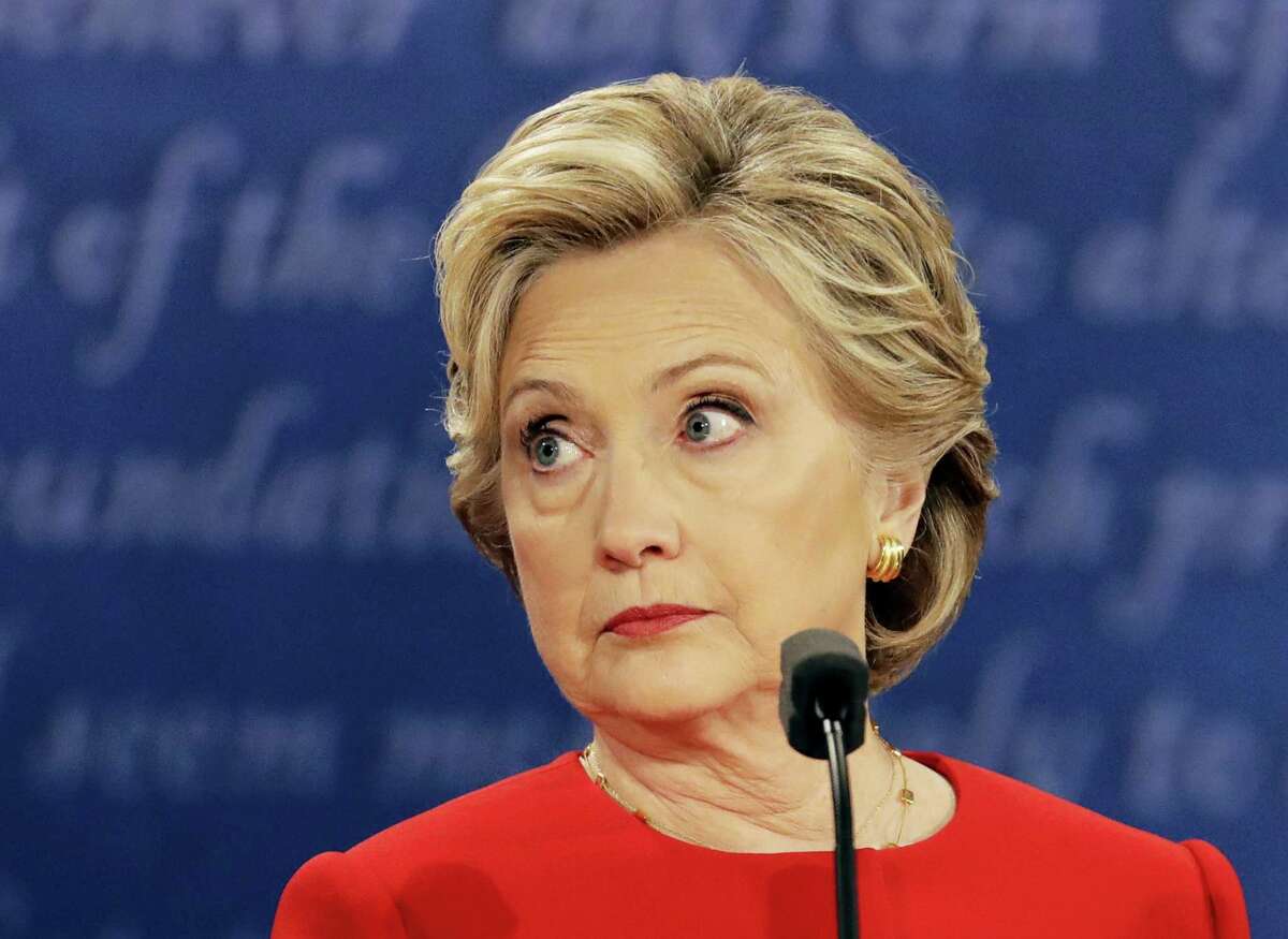 Democratic presidential nominee Hillary Clinton listens to Republican presidential nominee Donald Trump during the presidential debate at Hofstra University in Hempstead, N.Y., Monday, Sept. 26, 2016.