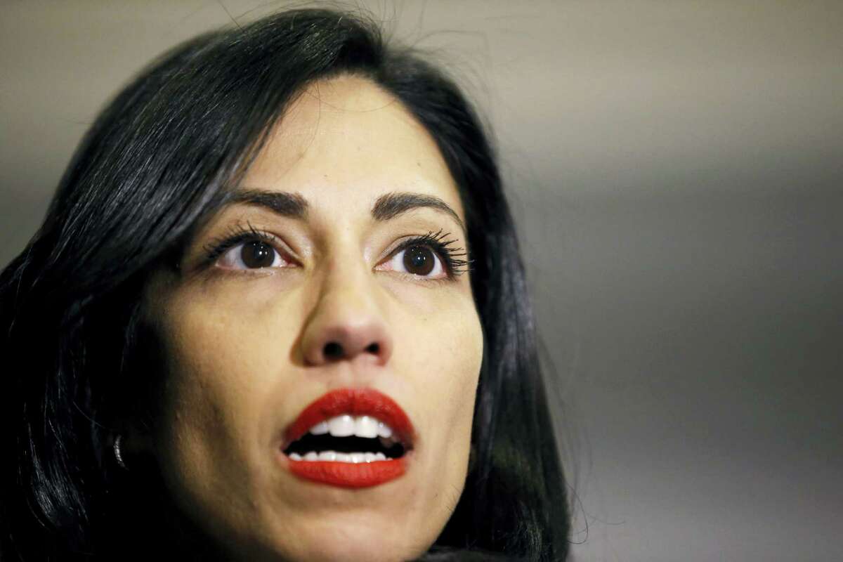 File-This Oct. 16, 2015, file photo shows Huma Abedin, a longtime aide to Hillary Rodham Clinton, speaking to the media after testifying at a closed-door hearing of the House Benghazi Committee, on Capitol Hill, in Washington. Abedin said in a legal proceeding that Clinton did not want the State Department emails that she sent and received on her private computer server to be accessible to “anybody,” according to transcripts released Wednesday, June 29, 2016. Her comments provided new insights into the highly unusual decision by the presumptive Democratic presidential candidate to operate a private email server in her basement to conduct government business as secretary of state.