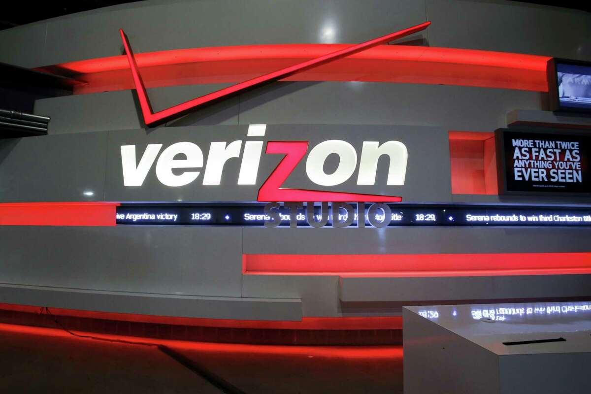 This April 7, 2013, file photo shows the Verizon studio booth at MetLife Stadium, in East Rutherford, N.J. Nearly 40,000 striking Verizon employees will return to work Wednesday, June 1, 2016, after reaching a tentative contract agreement that includes 1,300 new call center jobs, nearly 11 percent in raises over four years and the first contract for Verizon wireless store workers, a union said Monday.