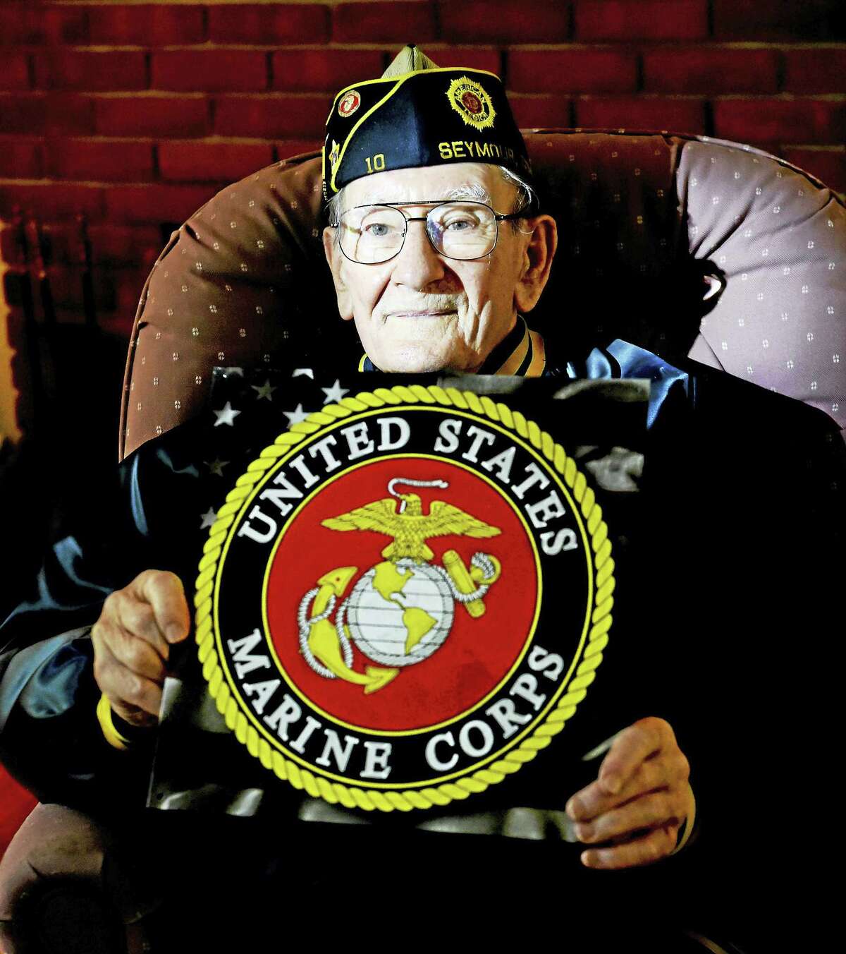 (Peter Hvizdak - New Haven Register)George Wityak, 92, of Seymour a World War II United States Marine Corp veteran and a member of the Emil Sanger American Legion Post 10 in Seymour, in his home. Wytak is one of six brothers who served in the military during World War II. Tuesday, May 17, 2016.