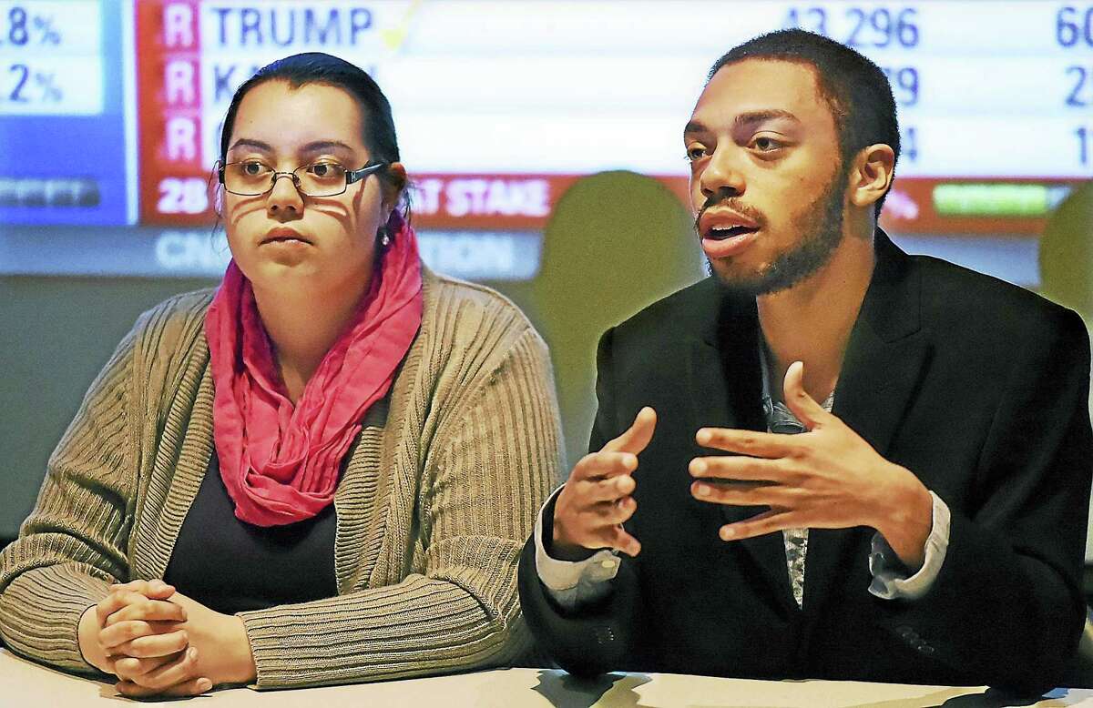 When asked if he would support Hillary Clinton, Southern Connecticut State University junior Corey Evans, right, said although he supports Bernie Sanders, he would vote for Hillary Clinton if Clinton is the Democratic candidate. At left is Mishele Rodriguez, who also supports Bernie Sanders. Both are members of the College Democrats and served as panelists during a primary election viewing party Tuesday at SCSU.