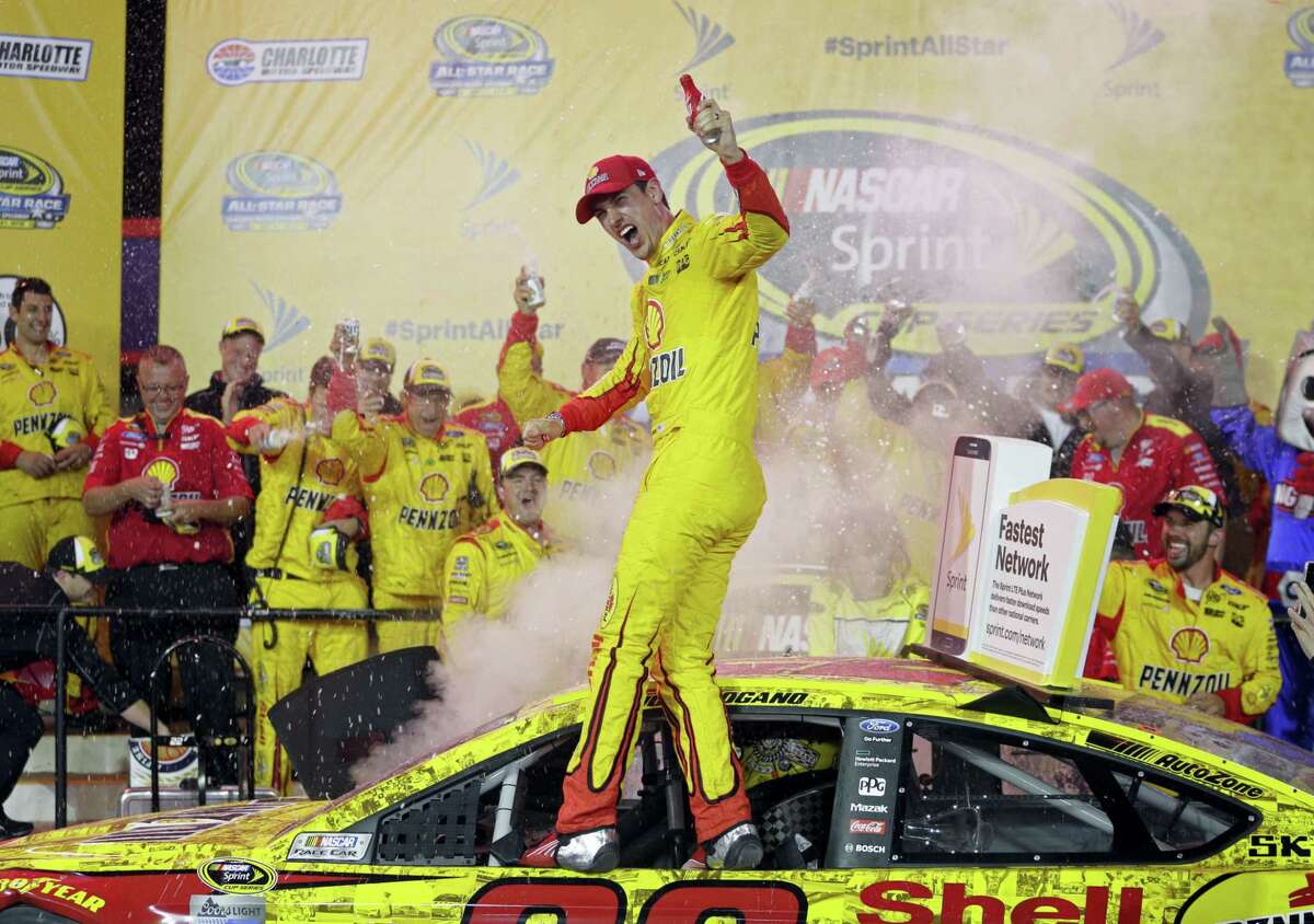 Joey Logano celebrates in Victory Lane after winning the NASCAR All-Star race at Charlotte Motor Speedway on Saturday.