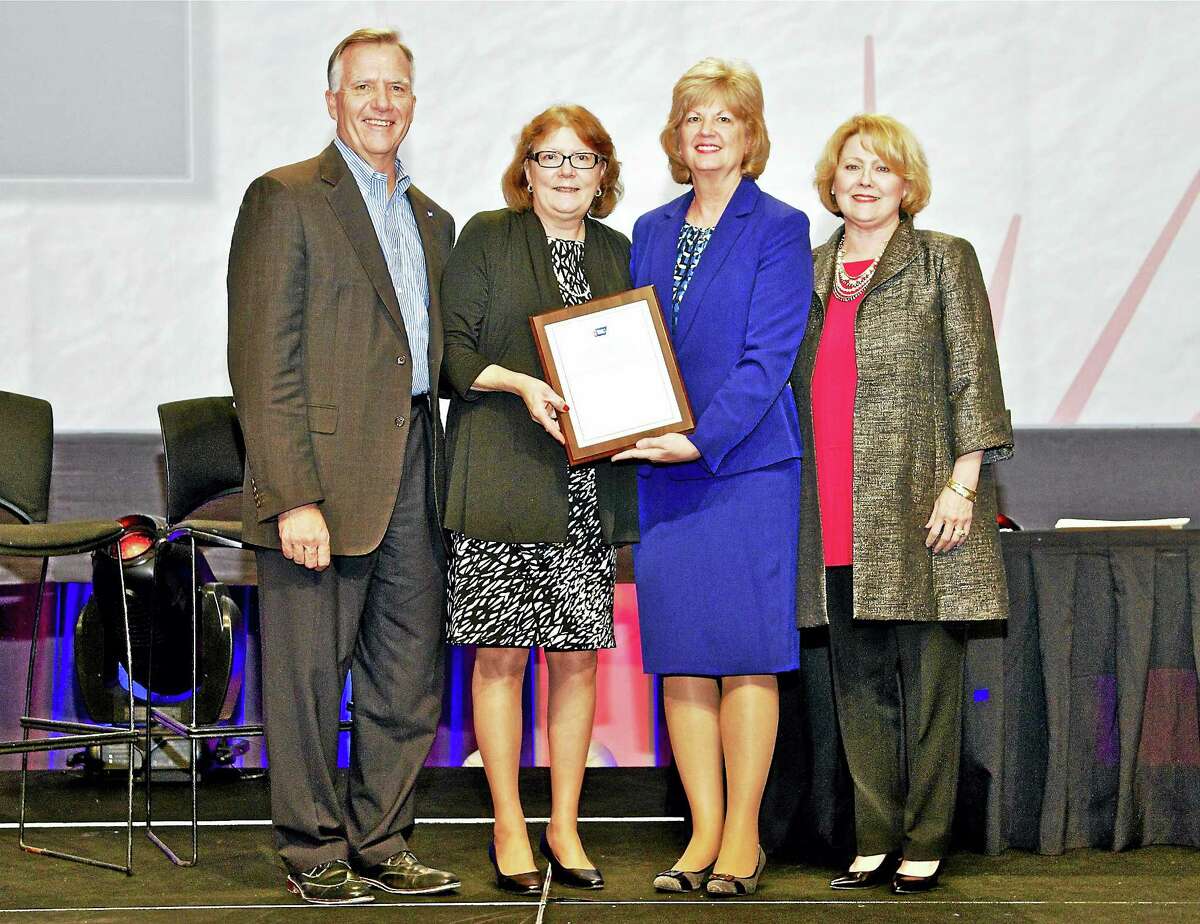CONTRIBUTED PHOTOFrom left, Gary Reedy, CEO, American Cancer Society; Kimberly Bielecki; Scarlott Mueller, chair, American Cancer Society Board of Directors; and Susan Henry, chair, Lane Adams Quality of Life Award Workgroup.