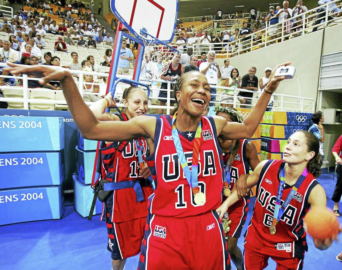 From left, Diana Taurasi, Tamika Catchings and Sue Bird celebrate during the 2004 Olympics in Athens, Greece.