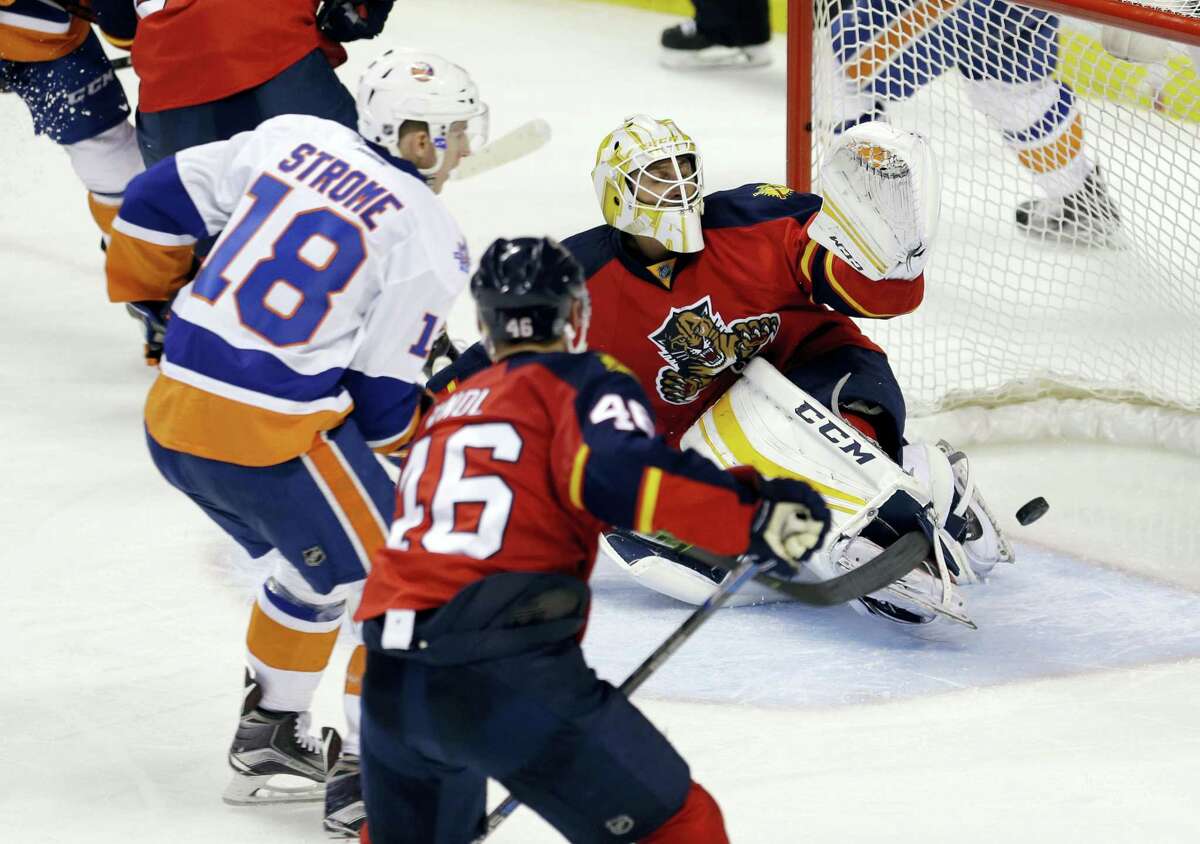 Islanders center Ryan Strome (18) scores against Panthers goalie Roberto Luongo during the third period Thursday.