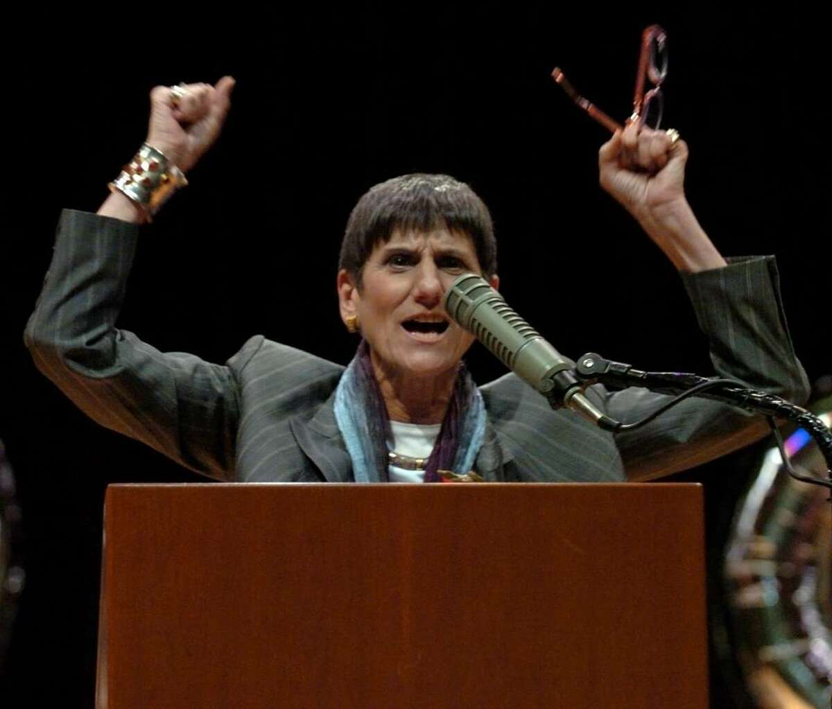 With arms raised U.S. Congresswoman Rosa DeLauro exclaims, "Congratulations!" to the students of Platt Technical School as she begins the key note speech at the school's graduation ceremony in Milford, Conn. on Friday June 11, 2010.