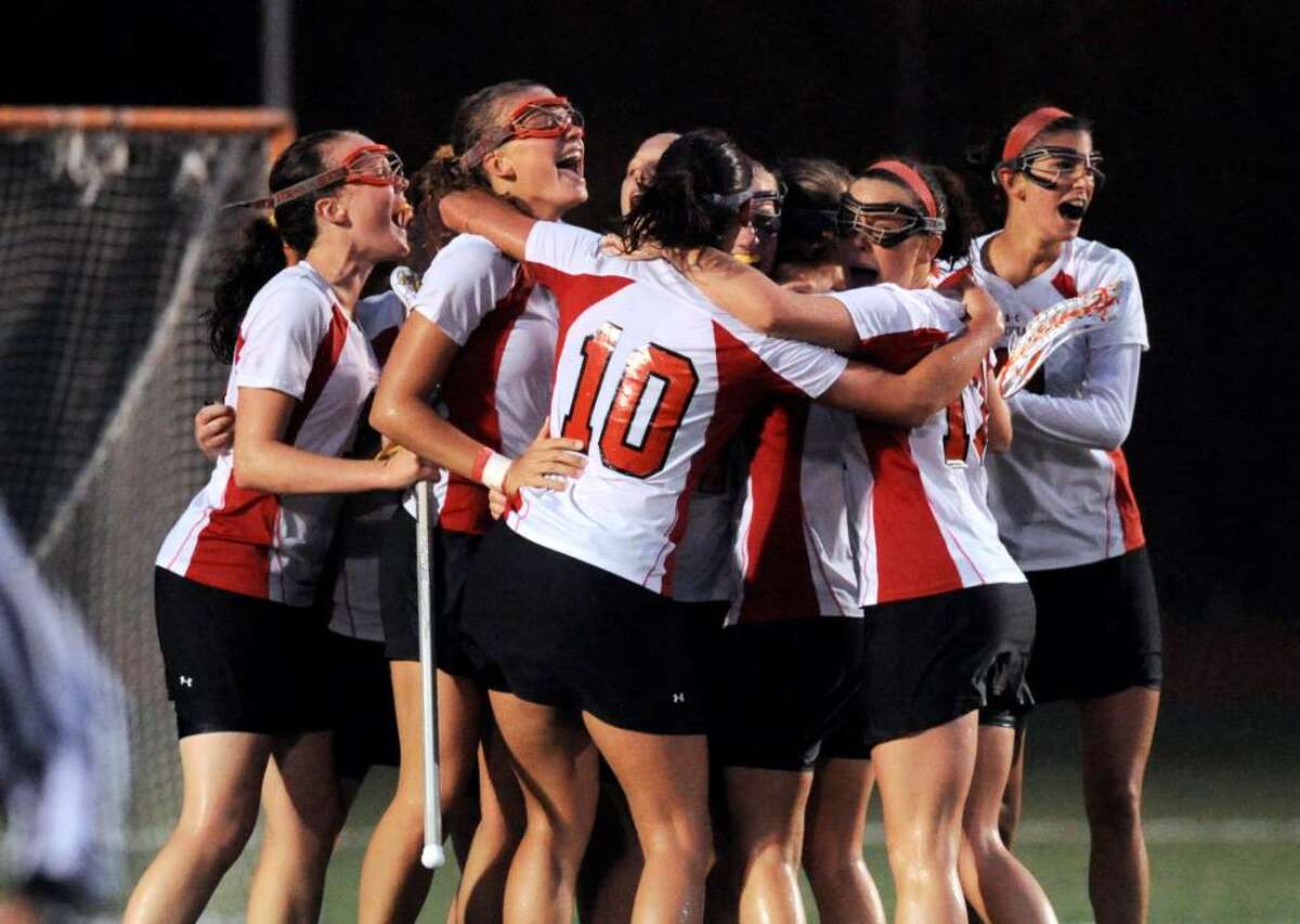 The Greenwich High School Cardinals celebrate an 11-9 victory over Darien High School, June 9, 2010 at Fairfield Warde High School, during the Girls Lacrosse Division I State Semifinals.