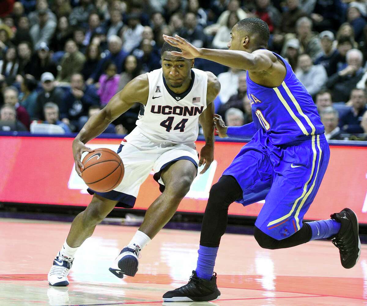 UConn’s Rodney Purvis (44) drives past Tulsa’s James Woodard (10) during the first half Saturday in Storrs.