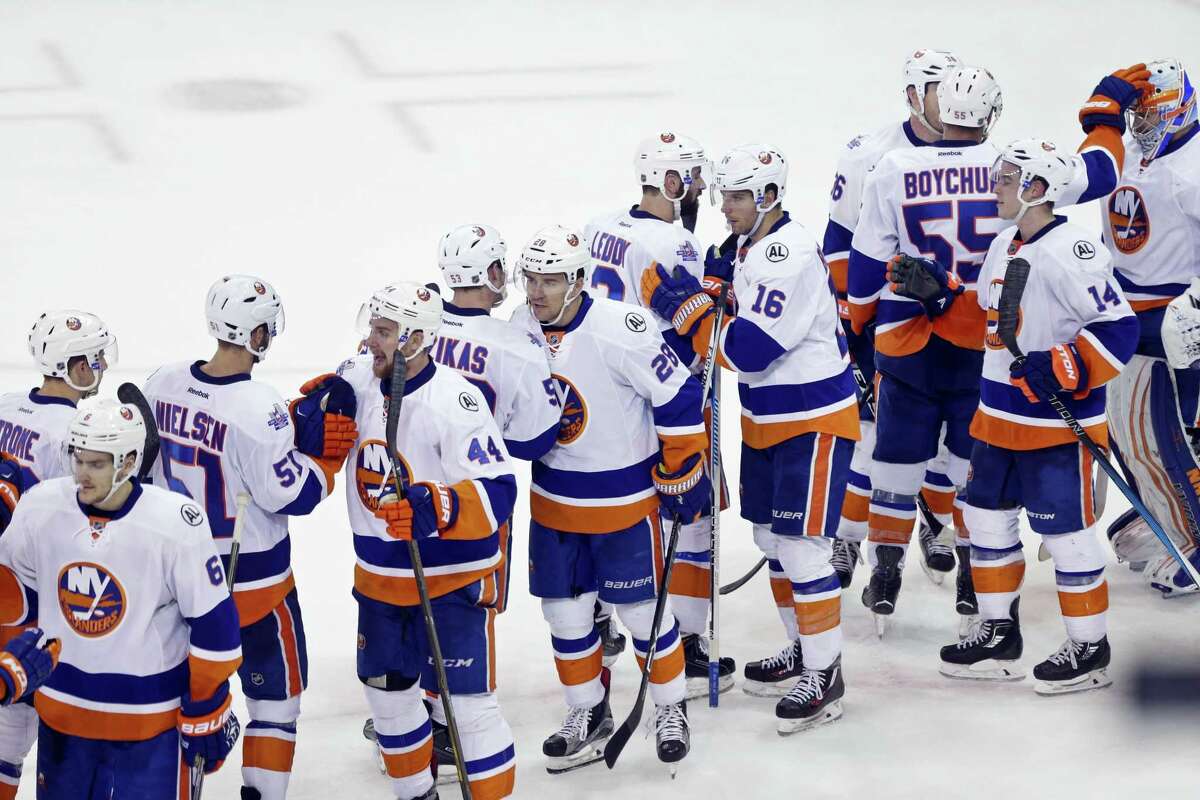 Members of the Islanders celebrate after their win over the rangers on Thursday.