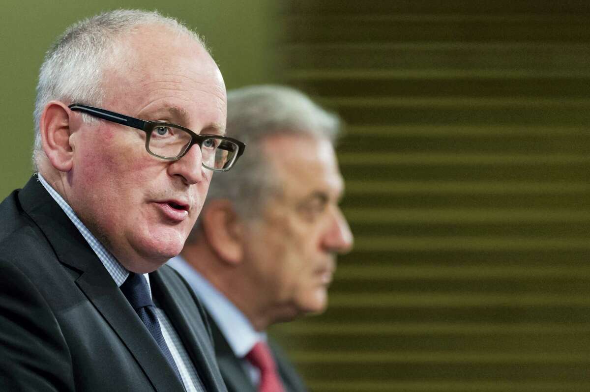 EU Commission First Vice President Frans Timmermans, left, and EU Commissioner for Migration, Home Affairs and Citizenship Dimitris Avramopoulos address the media on migration at EU Commission headquarters in Brussels on April 6, 2016. After a migrant crisis that has shaken the European Union, the EU’s executive wants a fundamental reform of policies that have heaped pressure on some nations like Greece and Italy.