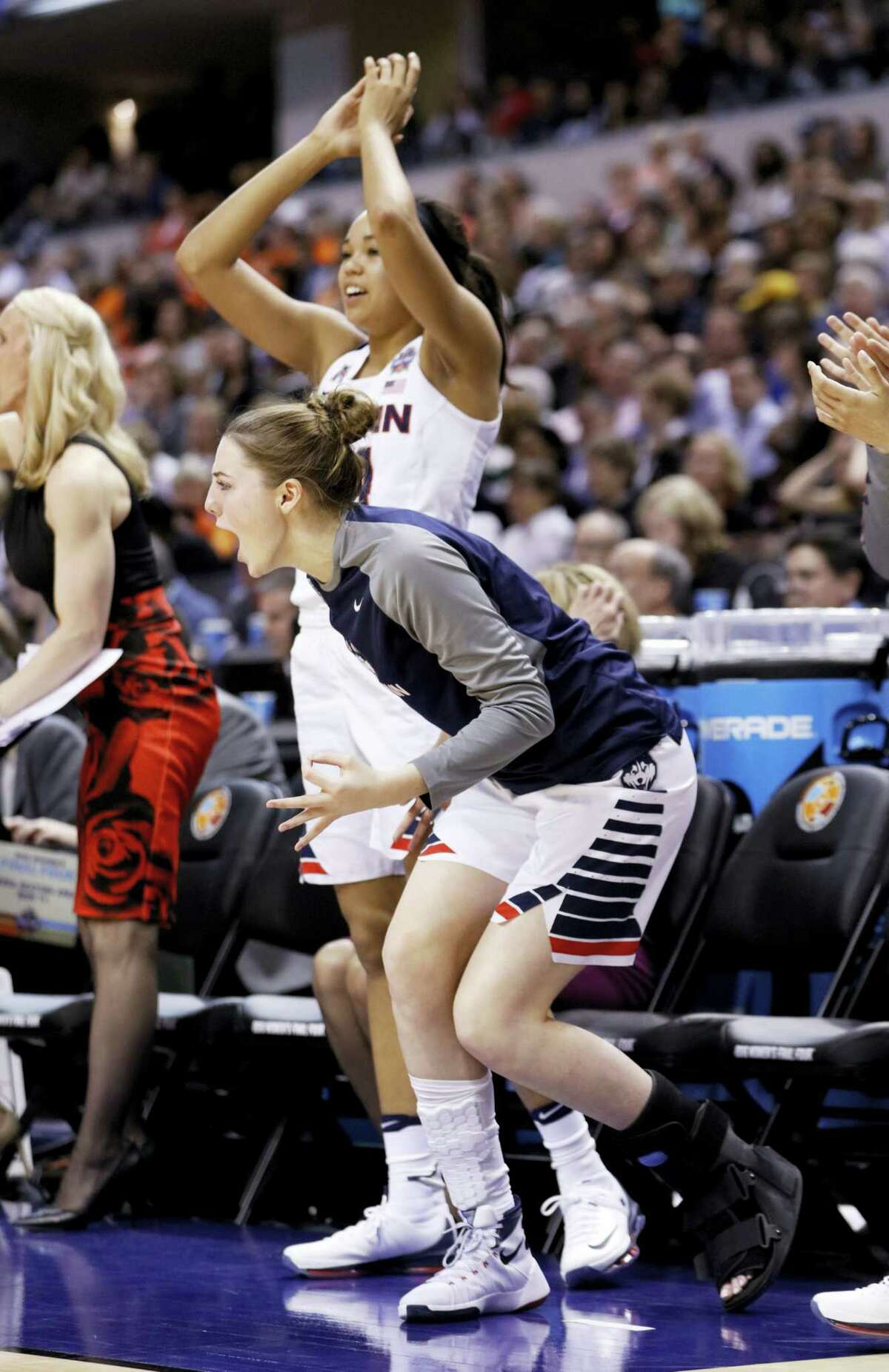 UConn’s Katie Lou Samuelson cheers during the second half of Sunday night’s national semifinal game against Oregon State. Samuelson suffered a season-ending broken foot.