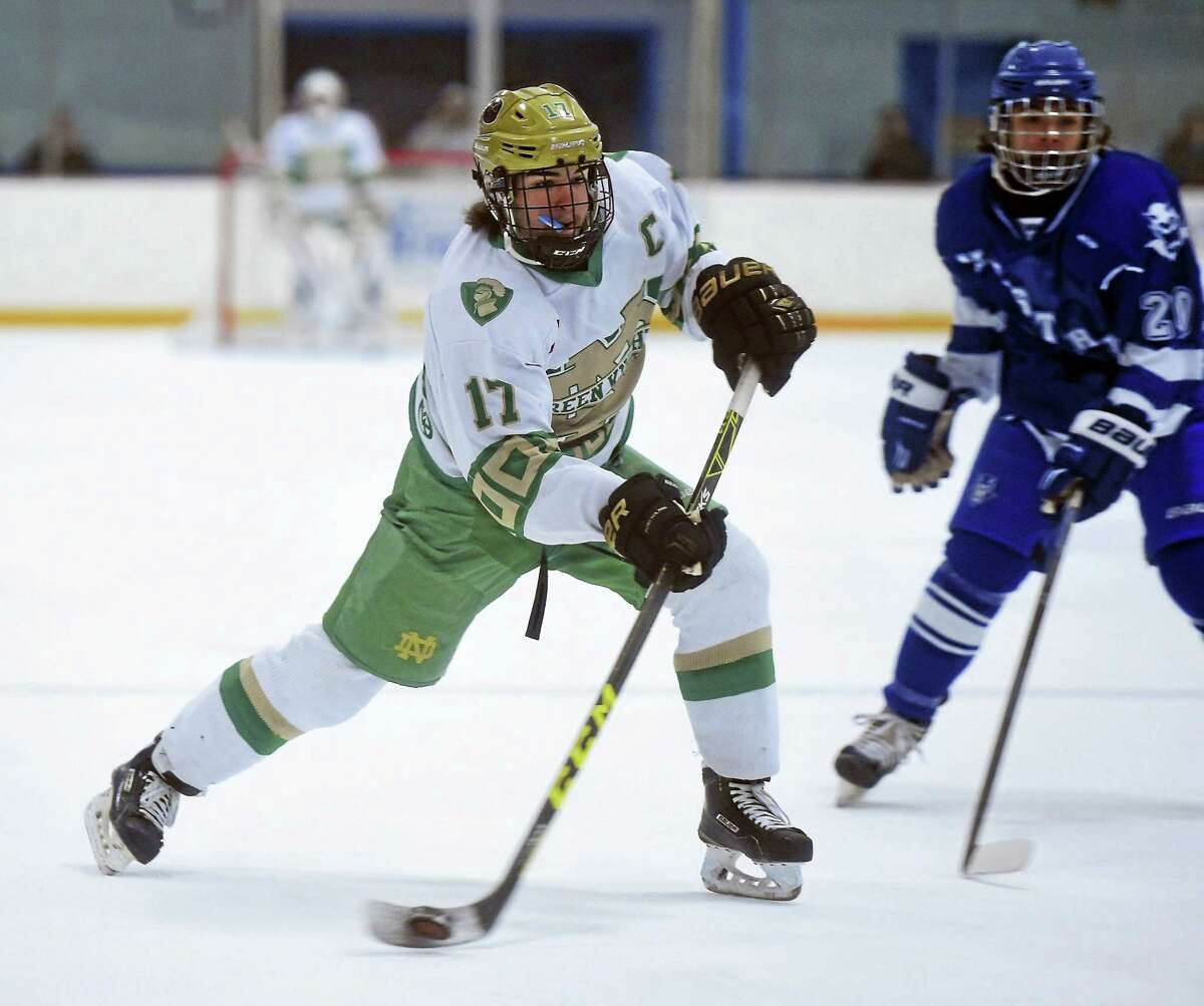 Notre Dame-West Haven’s Joe Ansaldo (17) chases down a puck against cross-town rival West Haven this past weekend. His team won, 8-0.