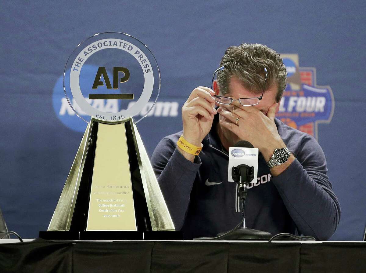 UConn coach Geno Auriemma wipes his eyes after being named the Associated Press Coach of the Year on Saturday.