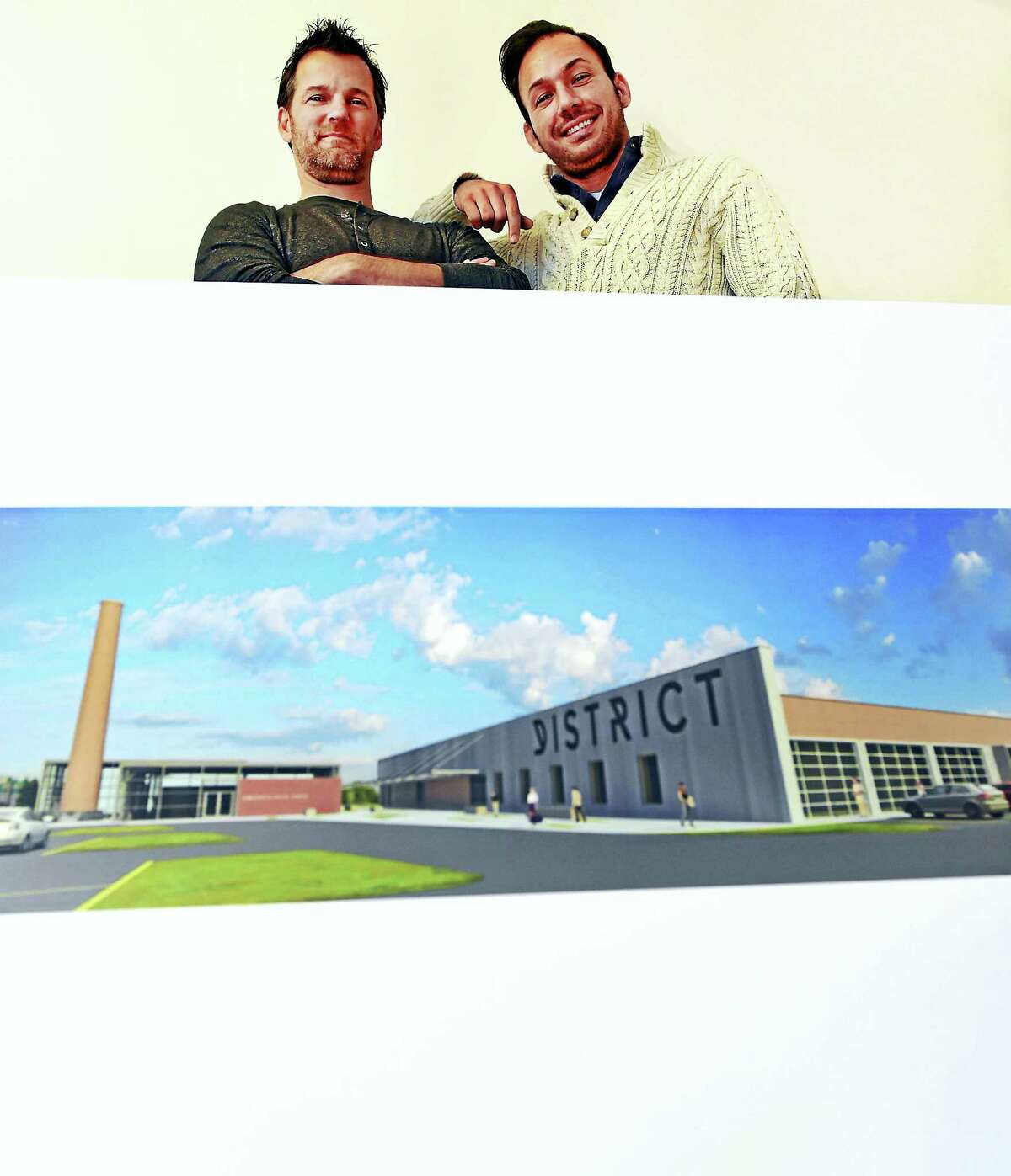 Eric O’Brien, owner of Urbane New Haven LLC, left, and David Salinis of Digital Surgeons, are expected to get approval necessary to convert the former Connecticut Transit bus depot at 470 James St. into space for technology and innovation-led companies. There will also be a restaurant and beer garden, entertainment and a kayak launch into the Mill River.
