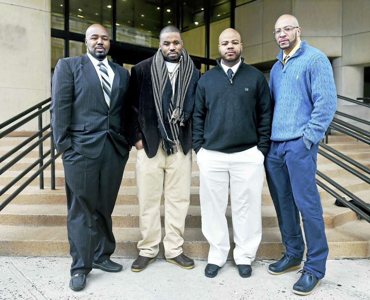 ARNOLD GOLD — NEW HAVEN REGISTER Left to right, Darcus Henry, Carlos Ashe, Johnny Johnson and Sean Adams are photographed last week in front of Superior Court in New Haven. The four were released from prison after serving 17 years for a murder in 1996 for which they were wrongfully convicted.