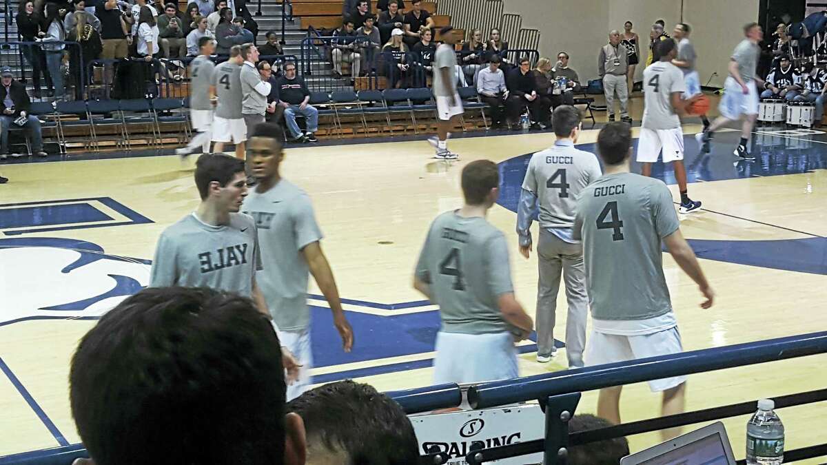 Yale basketball players wearing shirts in support of their teammate Jack Montague.