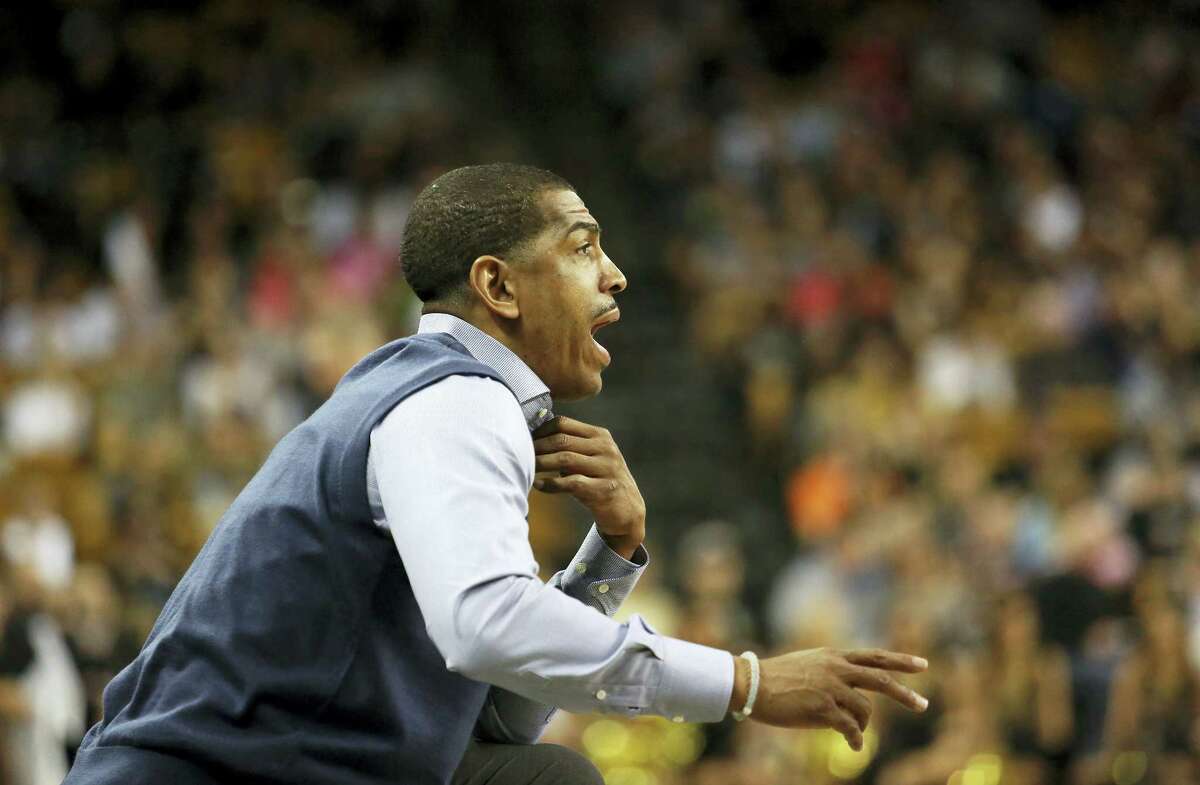 Connecticut head coach Kevin Ollie calls to his team during an NCAA college basketball game against Central Florida, Sunday, Jan. 31, 2016 at the CFE Arena in Orlando, Fla. (Jacob Langston/Orlando Sentinel via AP)